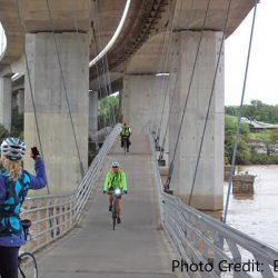 bikers on a large bridge