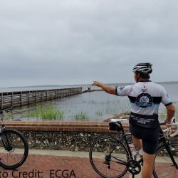 A biker in front of St. Marys River in Georgia