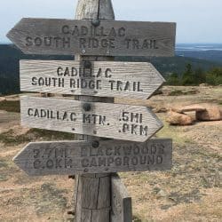 Directions sign in on hiking trail in Acadia National Park