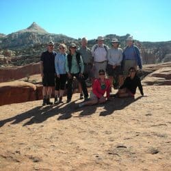 group of people posing for a picture on a hike