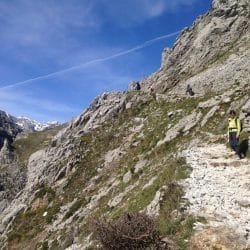 Hikers enjoy the rocky Cares Gorge trail in Los Picos de Europa, Espana