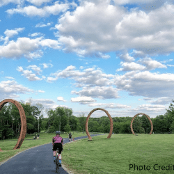 Biker on a trail through the Raleigh NCMA