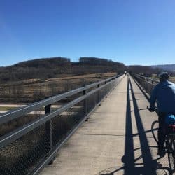 biker next to the great allegheny passage