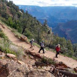 A group of hikers starts down the Bright Angel Trail into the Grand Canyon - it's a long ways down