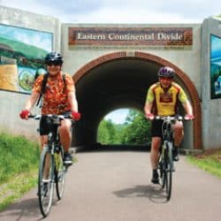 bikers riding through a tunnel