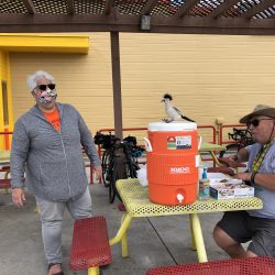 Man with a mask and water jug