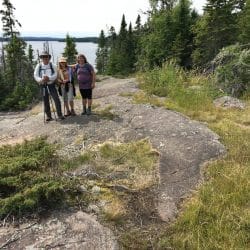 Hikers pose on a trail in Isle Royale National Park