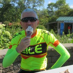 A biker enjoys ice cream in Maine