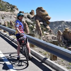 Biking the road into Saguaro National Park West from Tucson, surrounded by desert rock and cacti