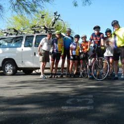 group of bikers outside of a van
