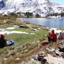 Hiker in front of a lake in Yosemite National Park