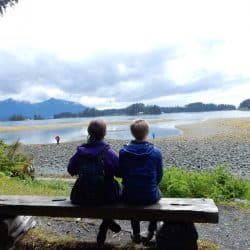 couple sit on a bench in Alaska
