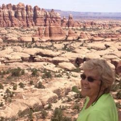 Woman smiling in front of a canyon